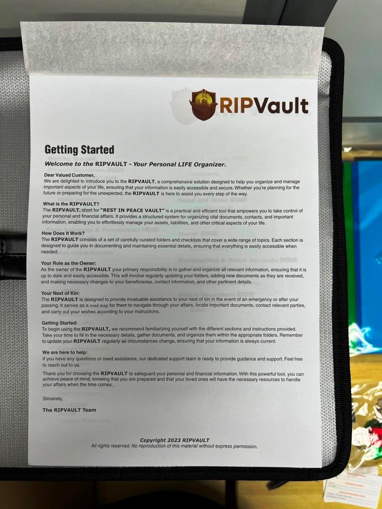 A printed document titled 'Getting Started' from RIPVault, outlining steps for organizing and managing personal life details. The document is placed on a desk with visible text and the RIPVault logo at the top.